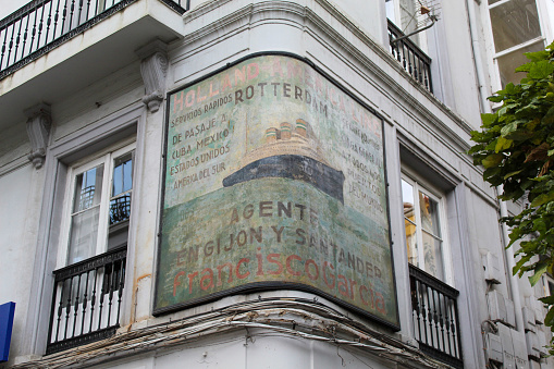 Santander, Spain  – October 31, 2022: Old advertising on a wall in Santander, Cantabria.