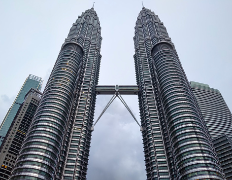 KLCC Petronas Twin Tower Malaysia menara kembar Asia sky blue horizontal view buildings icon tallest tourist silver signature landmark business travel city skyline outdoor