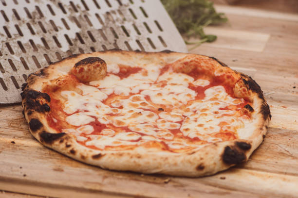 istock Serving hot pizza Margherita with tomato sauce and mozzarella 1445219170