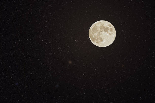 istock Night sky with many stars and bright full moon. Composite image - not to scale 1445219435