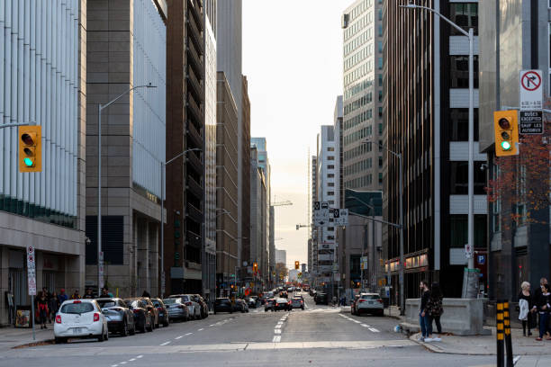 Ottawa, Canada - November 5, 2022: Cityscape with street lights in downtown. Traffic in the city.