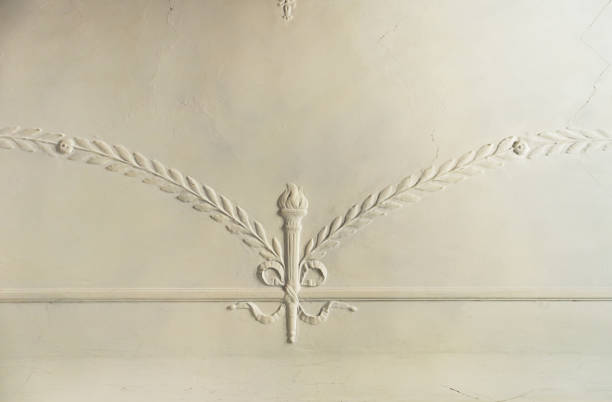 Gypsum molding pattern on the ceiling. Decorative gypsum finish in an old house stock photo