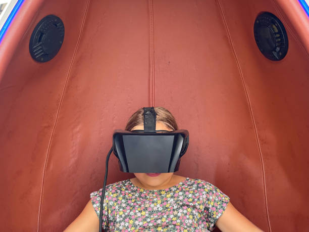istock Closeup of child girl using virtual reality technology headset 1445221079