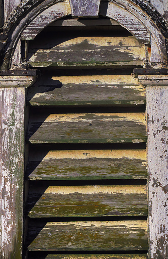 close up of a side of an old, weathered wood cupola, for sale at a salvage yard, Long Island, New York