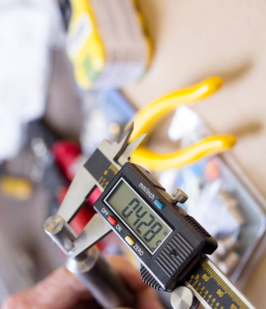 istock Blue collar -Caliper, instrument of measurement, with various tools on worktable. 1445221710