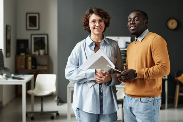 istock Two colleagues working together at IT office 1445225824