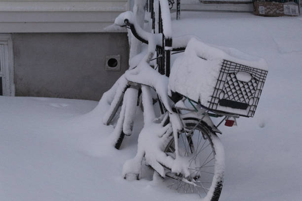 istock A bicycle with a basket covered in a thick layer of snow after a snow storm 1445226654