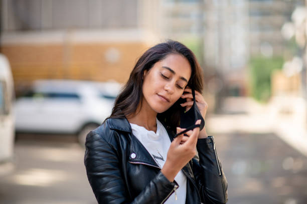 istock Woman puts her face mask on 1445226864