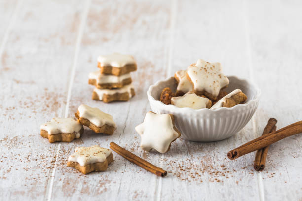 istock Christmas cinnamon star cookies on a wooden table 1445233411