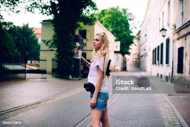 Serene Female Standing On Pavement In Summer Stock Photo - Download Image Now - 20-24 Years, Adult, Adults Only