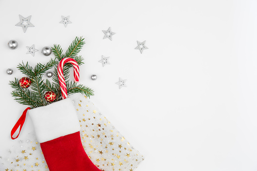Christmas sock with festive decorative details on white background isolated, copy space.