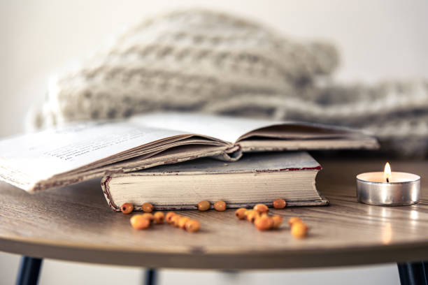 istock Cozy home composition with books on the table close-up. 1445237980
