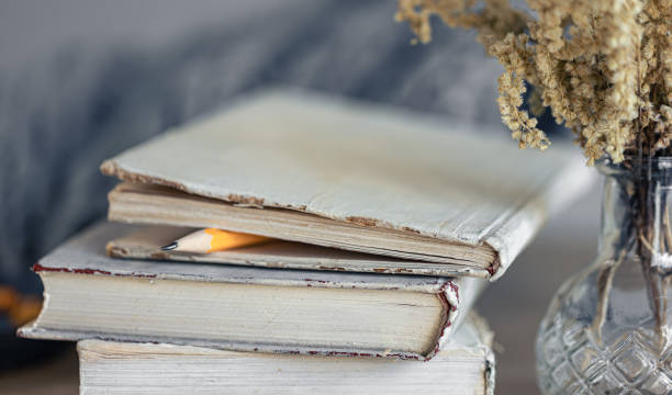 istock Cozy home composition with books on the table close-up. 1445238010