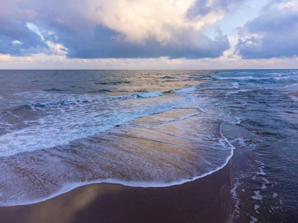 istock shooting from a flying drone over the sea with a dramatic sky before a storm 1445243266