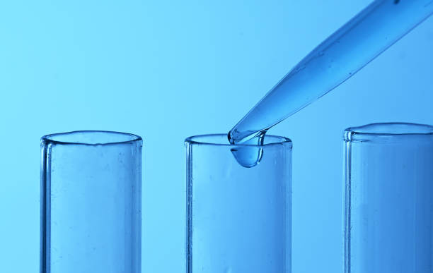 istock Drop from pipette drips into laboratory test tubes. 1445243591