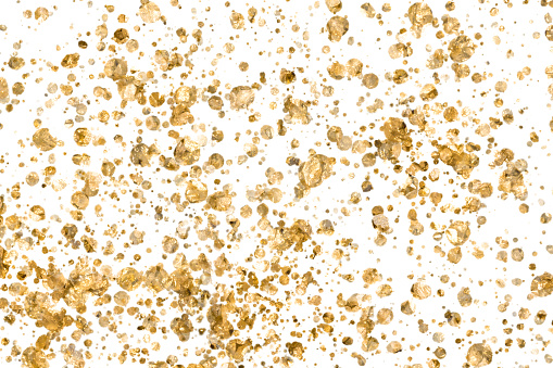 golden nuggets texture white background full frame