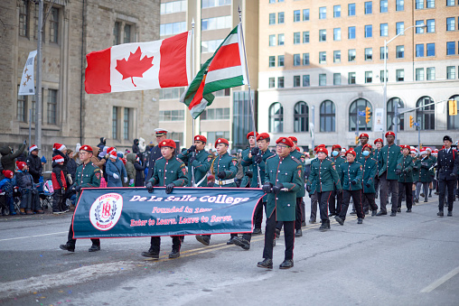 Toronto, Ontario, Canada- November 20th, 2022: De La Salle College marching band in Toronto’s annual Santa Claus Parade.