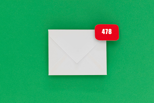 White envelope with notification sign with the number 478. Representing accumulated mails in mailbox.