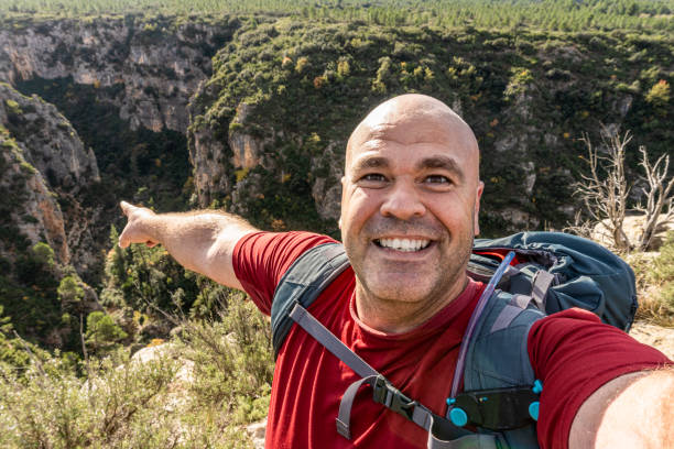 istock hiker man happy selfie outdoors nature 1445250635