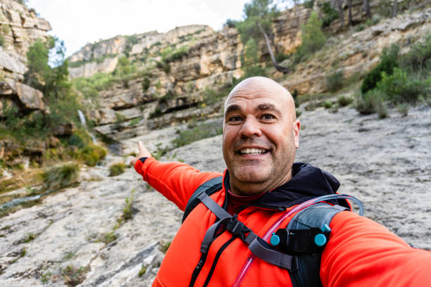 istock hiker man happy selfie outdoors nature 1445250675