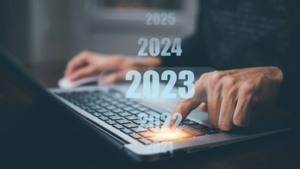 istock Businessman using laptop with new planning, Businessman using pen touch on 2023 year number, start new year concept digital trends, industry and business trend, strategy, investment, 1445251420