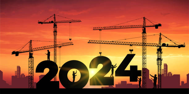 istock Black silhouette staff works as a to prepare to welcome the new year. Large construction site, many construction cranes set numbers 2024. Construction team sets numbers for New Year 2024. Vector. 1445253929