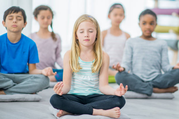 istock Children in a Lotus Pose 1445256782
