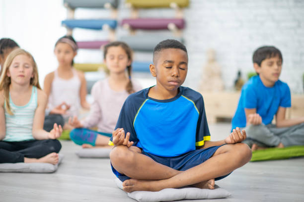 istock Children in a Lotus Pose 1445256784