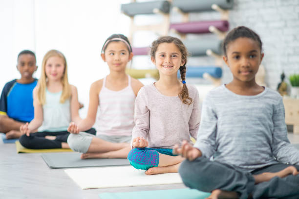 istock Children in a Lotus Pose 1445256796