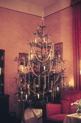 Germany, 1957. Christmas tree in a living room corner.