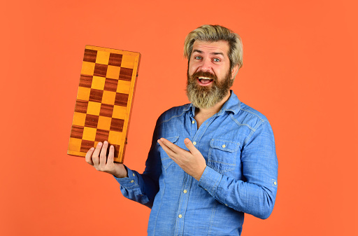 Teacher chess competition. Game strategy concept. Board game. Man playing chess. Intelligent bearded hipster. Cognitive skills. Hobby and leisure. Intellectual games. Chess lesson. Chess figures.