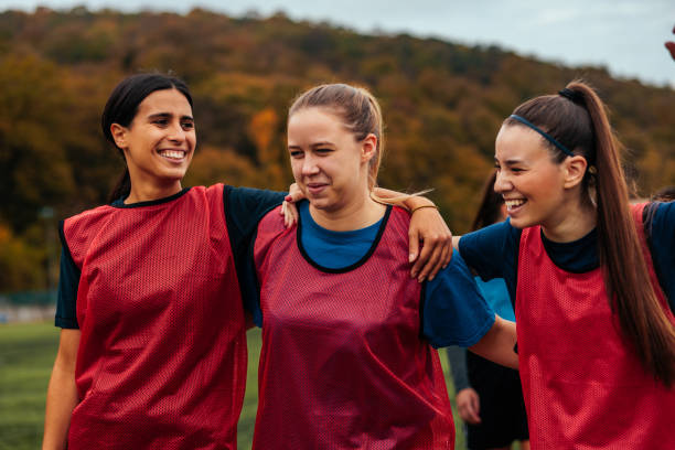 istock Cheerful soccer girls on field. 1445262989