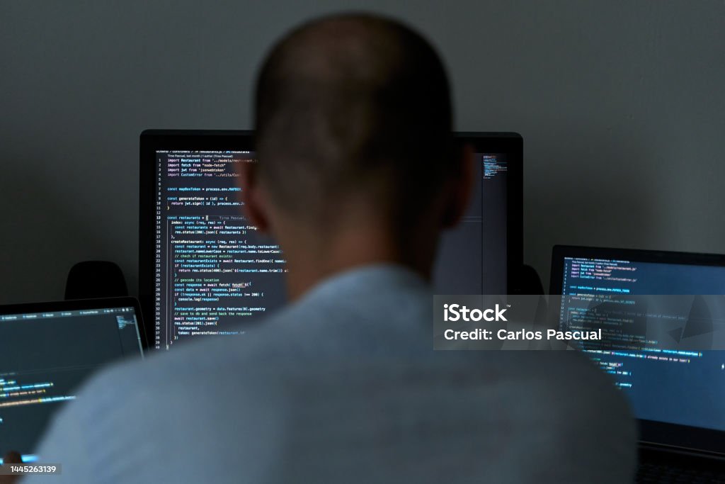 Young Male Writing Coding On Three Screens Software Programmer And Web ...
