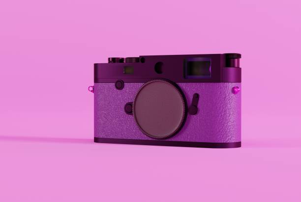 istock Retro photo camera on a pink background. 1445263949
