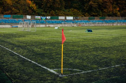 An empty soccer field shown from the corner flag position.