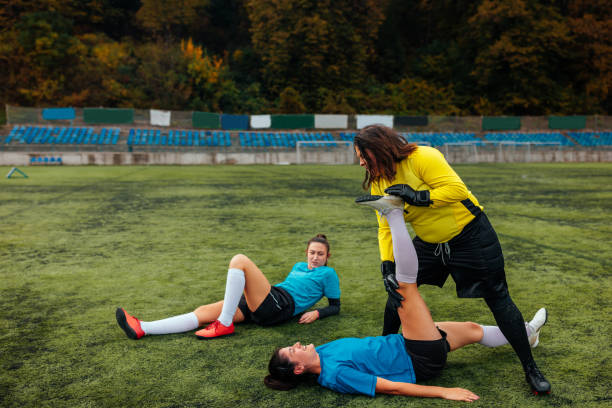 istock Female soccer players stretching. 1445264262