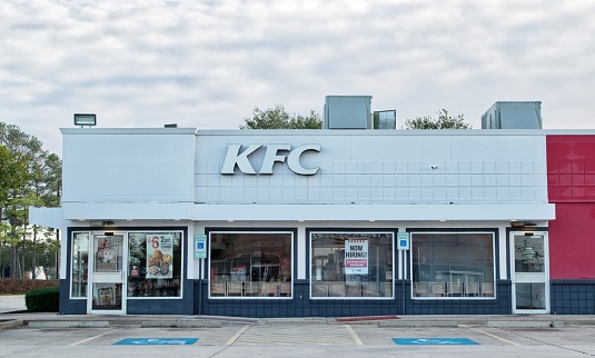 Houston, Texas USA 11-11-2022: KFC storefront exterior in Houston, TX. Kentucky Fried Chicken, iconic American fast food restaurant chain founded in 1930.