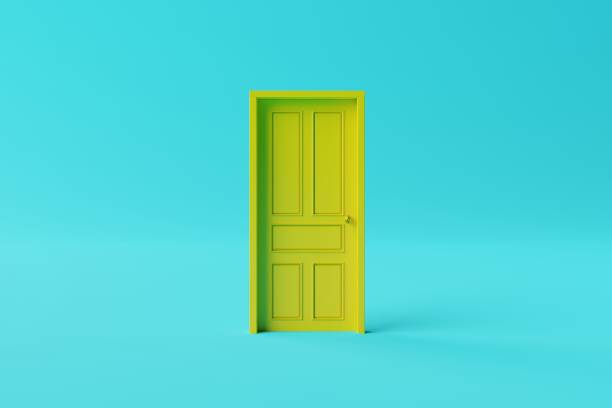 istock The closed yellow door on a yellow background. 1445265868
