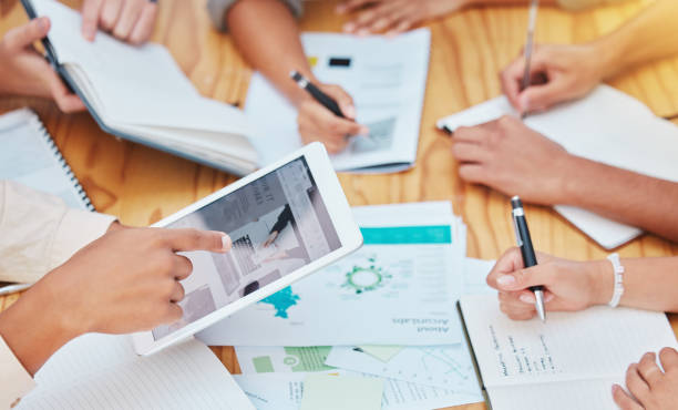 istock Marketing or advertising team with a tablet planning online with collaboration for creative ideas and brainstorming. Teamwork hands in a business meeting with data and support with digital technology 1445268216