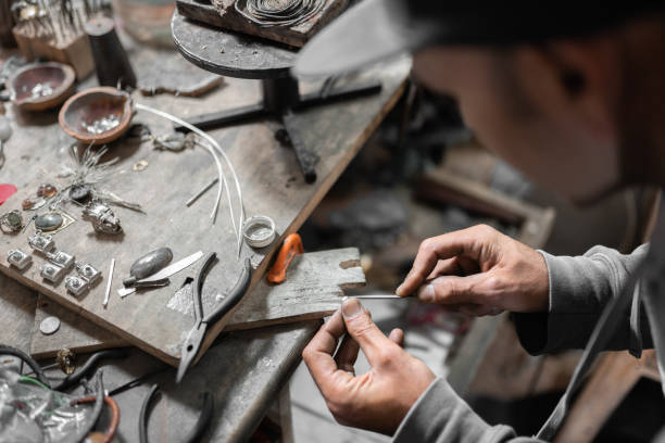 istock A craftsman jeweler is using a file tool to create a jewel 1445269667