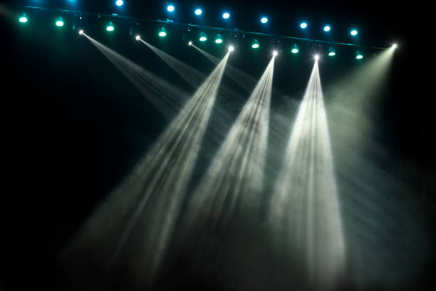 istock Blue and white concert stage show party lights on black background 1445269721