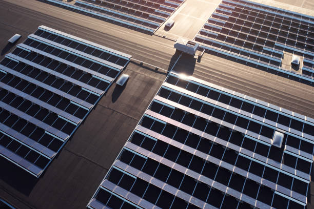 Solar panels on a rooftop in sunlight stock photo