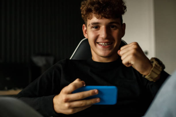 istock Teenager boy using the mobile phone 1445276130