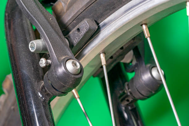 brake support and pads of the V-Brake system for mountain bike and MTB,on green background. stock photo
