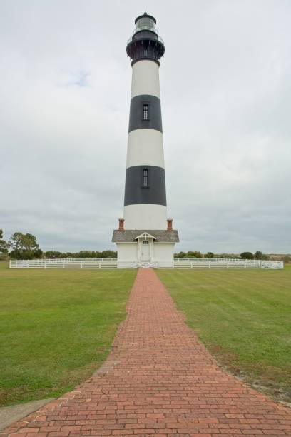 istock Brick path  to Bodie Island lighthouse standing before thick clouds 1445278463