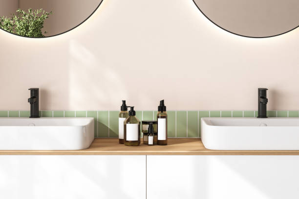 istock 3D render close up white vanity counter with ceramic washbasin and modern style faucet in a bathroom with morning sunlight and shadow. Blank space for products display mockup. Background, Wall tiles. 1445280158