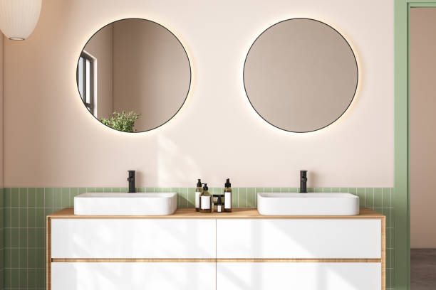 istock 3D render close up white vanity counter with ceramic washbasin and modern style faucet in a bathroom with morning sunlight and shadow. Blank space for products display mockup. Background, Wall tiles. 1445280164