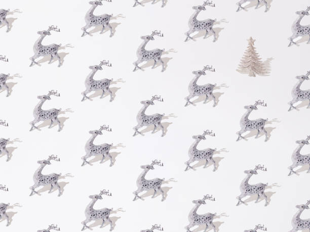 istock Silver decorative reindeer with glitter Christmas tree on a white background. Pattern. 1445280594