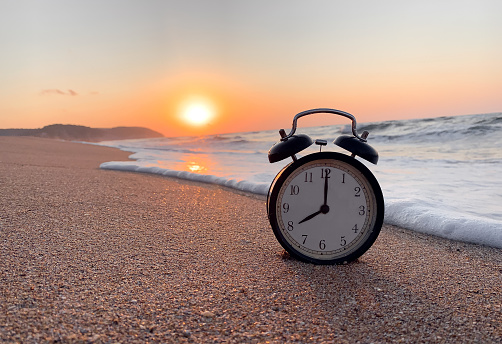 Beach Time, An Old Fashion Alarm Clock on Sandy Beach