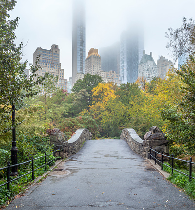 Gapstow Bridge in Central Park  in early autumn with changing colors in the early morning